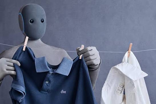 1X NEO humanoid robot doing laundry