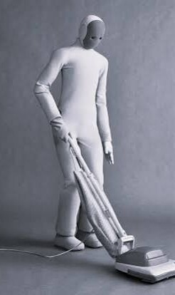 1X NEO humanoid robot vacuuming
